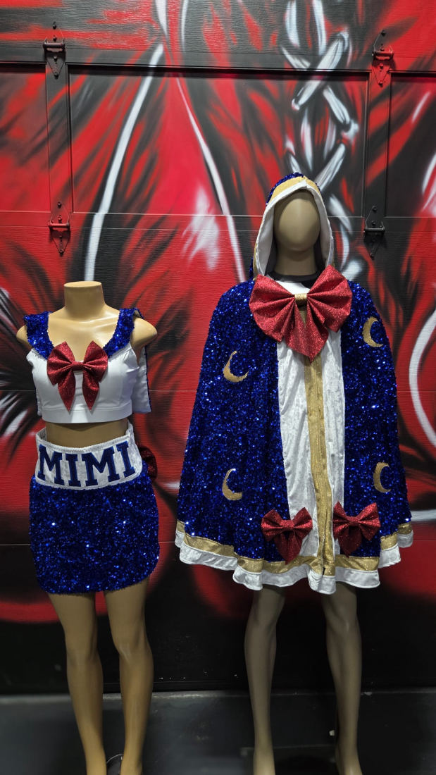 Custom blue sequin "MIMI" ring-walk set and matching entrance cape on mannequins