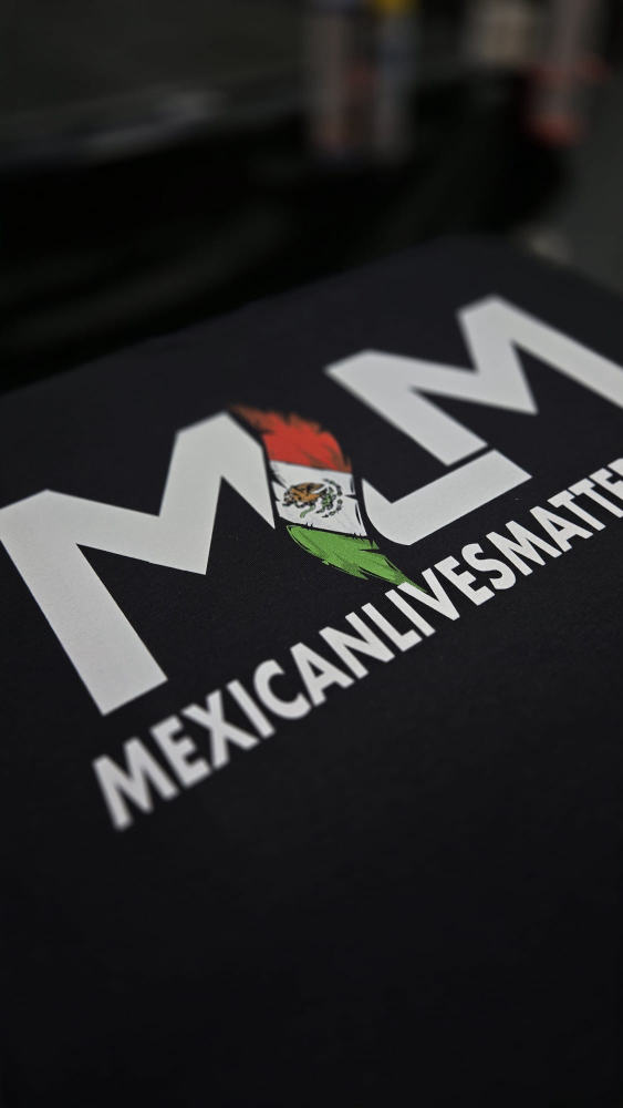 Black tee with a bold MexicanLivesMatter wordmark and Mexican flag accent