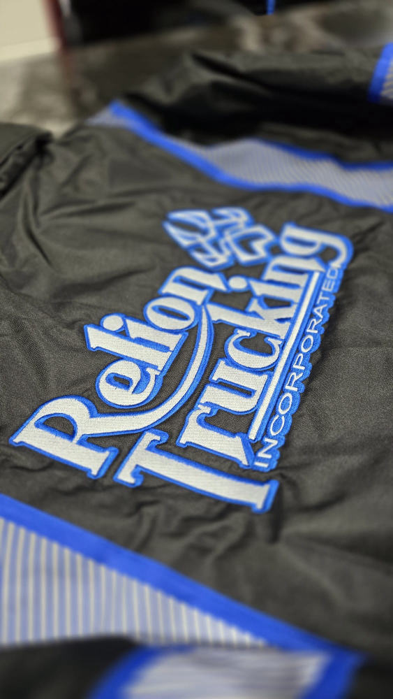 Reflon Trucking Incorporated logo embroidered on a jacket