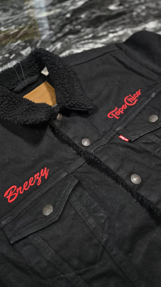 Topo Chico embroidered jacket with a personalized "Breezy" name
